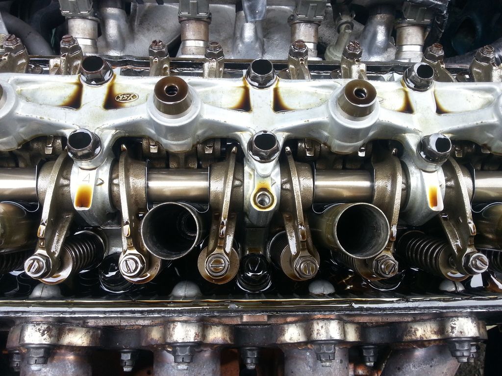 does this look like coolant and oil mixing? (under valve cover) D